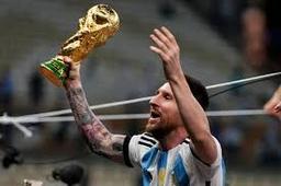 How did football hold Lionel Messi's hand?